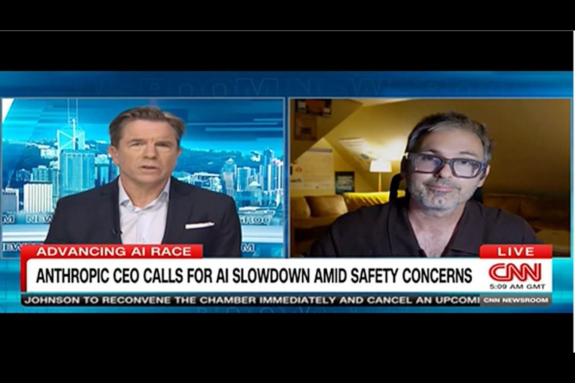 A CNN anchor interviews Chris Mattmann remotely about artificial intelligence safety, with an on-screen headline reading, “Anthropic CEO calls for AI slowdown amid safety concerns.”