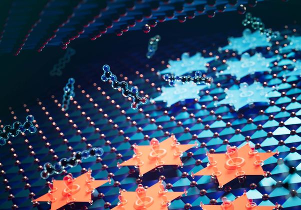 Close-up of a molecular structure with interconnected atoms and hexagonal patterns in blue and orange tones.