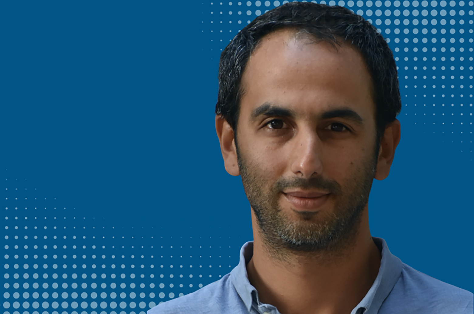  close  Headshot of Pablo Fajgelbaum wearing light-blue shirt against a blue background.