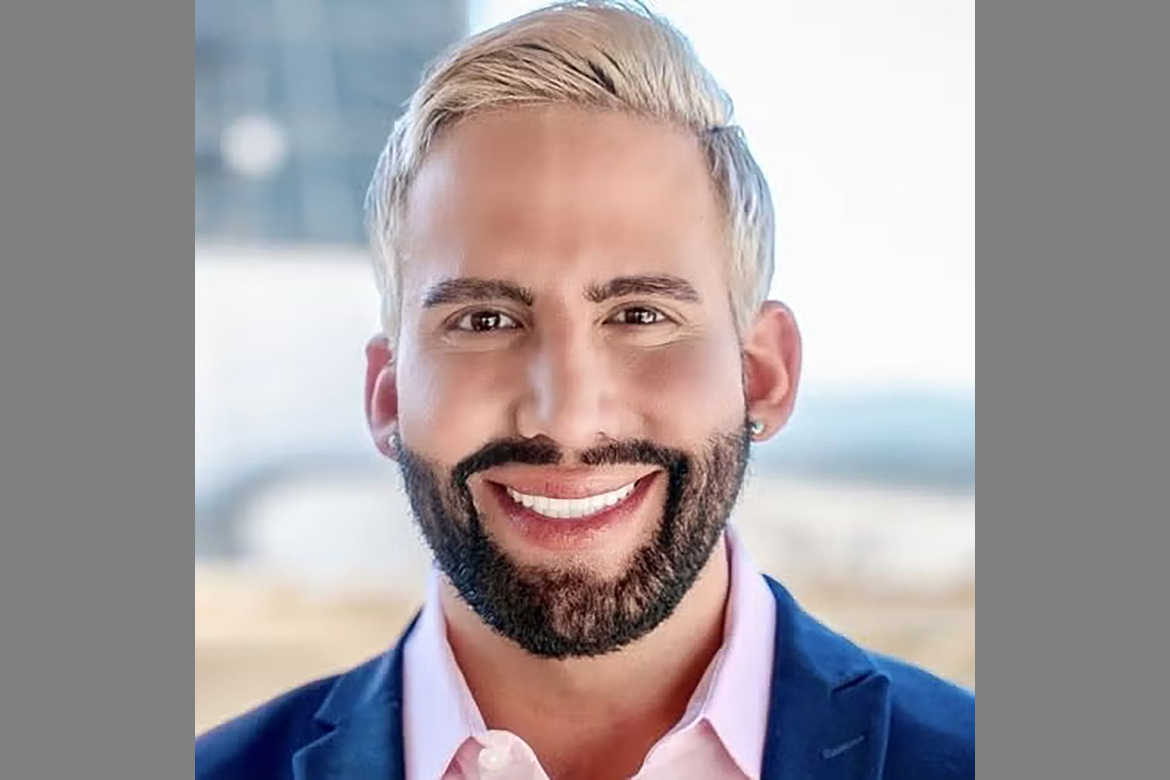 Headshot of Matthew Mimiaga in pink button-down and dark blue jacket.
