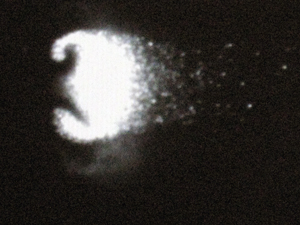 Vortex with trailing particles