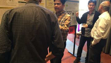 Two students present their research to interested SKC attendees at the recent conference. Poster Presentations