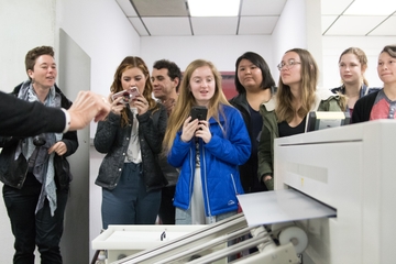 Amaris Ketcham (L) with students as they watch UNM's 2019 Scribendi magazine printed. IMG_5821