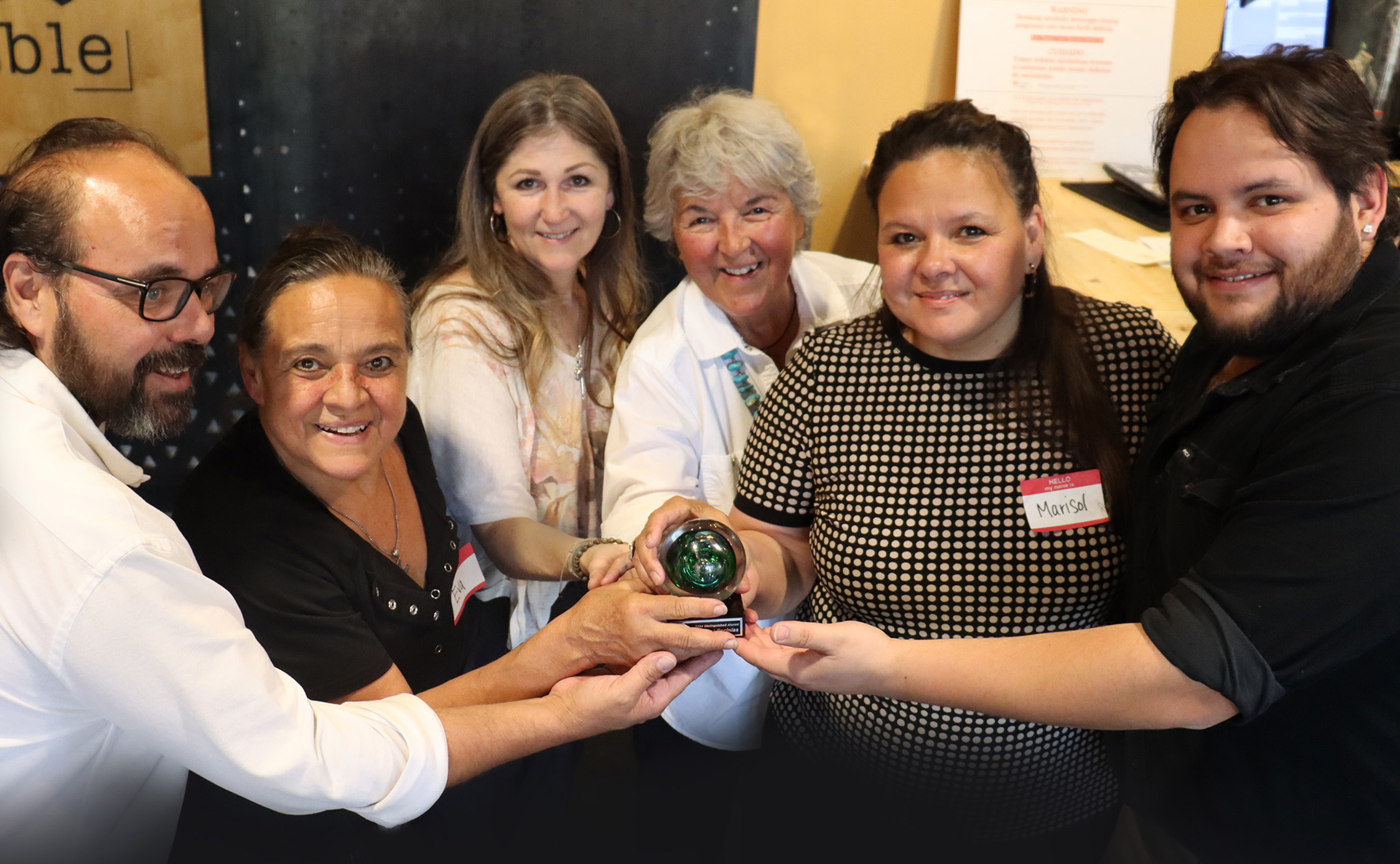 Distinguished Alumni Award recipient Marisol Encinias and team