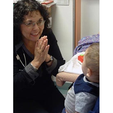 A Pediatric Nurse Practitioner works with a youn patient A Pediatric Nurse Practitioner works with a youn patient