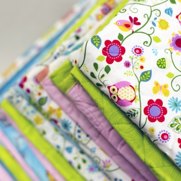 Handmade quilts warm UNMH newborns, honor donor's daughters