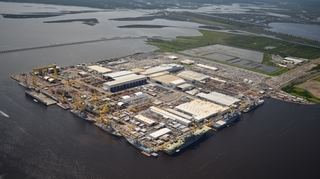 Aerial view of HII’s Ingalls Shipbuilding division in Pascagoula, Mississippi, taken in June 2017. Ingalls is the only U.S. shipyard currently building four classes of military ships: amphibious assault ships (LHAs), amphibious transport docks (LPDs), guided missile destroyers (DDGs) and National Security Cutters (NSCs). Photo by Lance Davis/HII Ingalls Shipbuilding