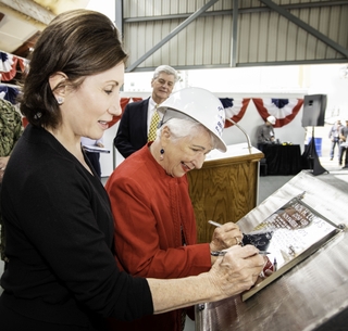 Ship’s Sponsors (left to right) Catherine B. Reynolds and Ruby Lucas trace their initials onto a steel plate that will be welded inside the guided missile destroyer Jack H. Lucas (DDG 125). Looking on is Mississippi Governor Phil Bryant, who spoke at the ceremony. Photo by Derek Fountain/HII Jack H. Lucas (DDG 125) Keel Authenticated