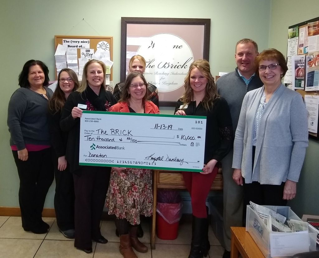 BRICK Board Member Rhonda Sundberg (left), Benevolence Manager Sam Ray, Krystel Dunlavy, BRICK Executive Director Liz Seefeldt, Cynthia Bodoh, Crystal Mattson, Brad Kowieski and BRICK Board Secretary Julie Stipetic.