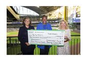 LaDonna Reed, Associated Bank and Cecelia Gore, Brewers Community Foundation, present a $100K check to Wendy Baumann of WWBIC to support minority, women and veteran owned businesses LaDonna Reed, Associated Bank and Cecelia Gore, Brewers Community Foundation, present a $100K check to Wendy Baumann of WWBIC to support minority, women and veteran owned businesses