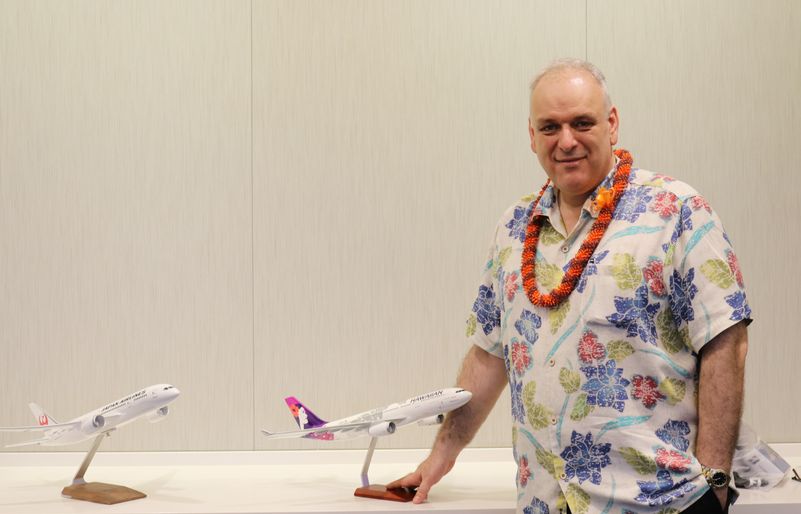 Theo poses with JAL and Hawaiian Airlines' model aircraft in Honolulu. The comprehensive partnership, which was announced in September 2017, will greatly enhance the ease and comfort of travel for passengers traveling between the two island chains. Theo Model Aircraft