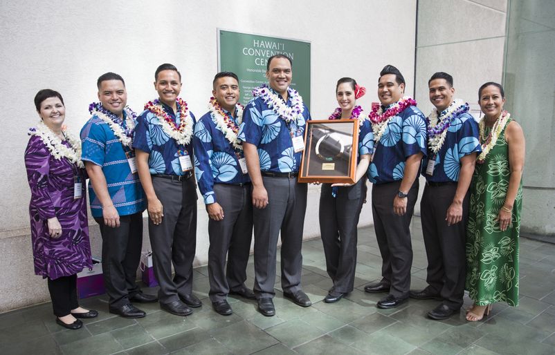 Crew members involved in the ‘ōlelo Hawai‘i flights joined the award reception and were recognized for their work in making our ‘ōlelo Hawai‘i projects a success. (L to R): Robin Sparling, vice president of in-flight services, John Borden, manager of in-flight services, flight attendants Punahele Kealanahele-Querubin, Kainoa McGill, Hoku Kamakeeaina, Malia Kruger, Kaʻohi Kahaunaele-Contrades, Keawe Goodhue, and Debbie Nakenelua-Richards, director of community relations. IMG_9206