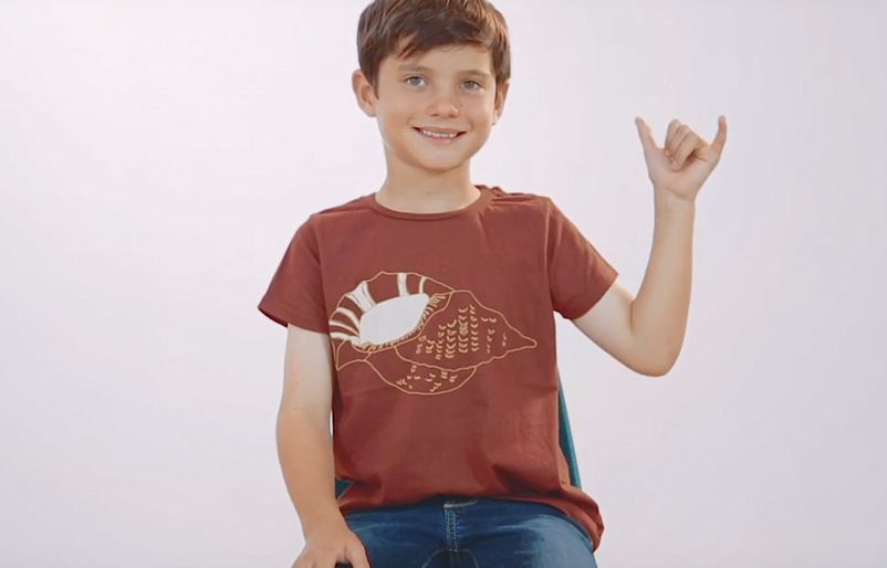 A screenshot from the episode 'Calm,' where keiki are engaged with relaxing stretches and exercises, including throwing up their best shaka! screengrab