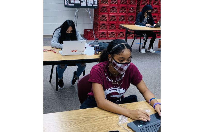 Students using our donated earbuds in Farrington High's learning lab. 55DAEF06-862A-43ED-863C-02DD7202940F