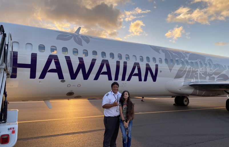 Naval pictured with his daughter Miabella on the tarmac at the Daniel K. Inouye International Airport (Editor's note: This photo was taken prior to the COVID-19 pandemic.) IMG_5521