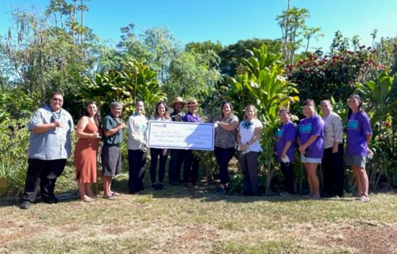 Hawaiian Airlines and The Maui Farm posing with the donation check themauifarm