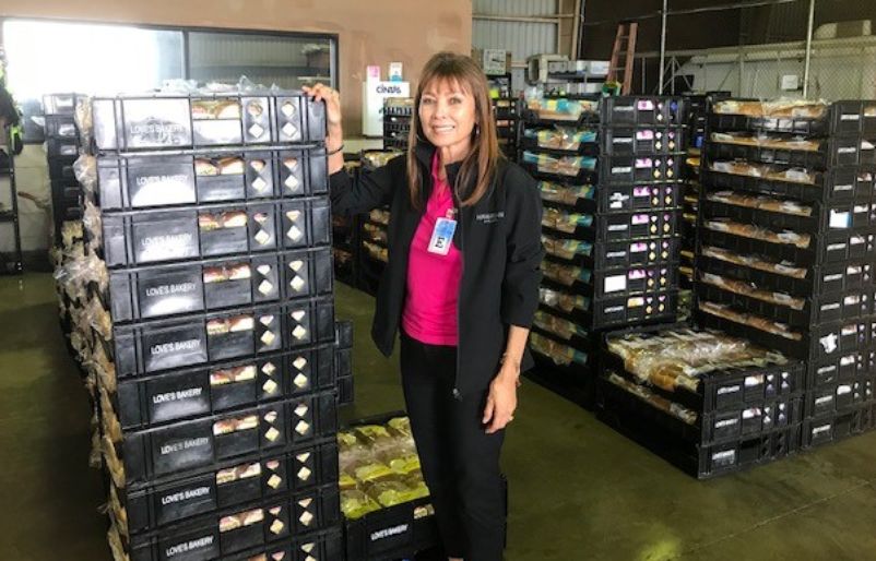 Hayashi pictured with Love's breadbaskets while in Līhuʻe, Kauaʻi in 2018. Love's shipment in LIH 2018