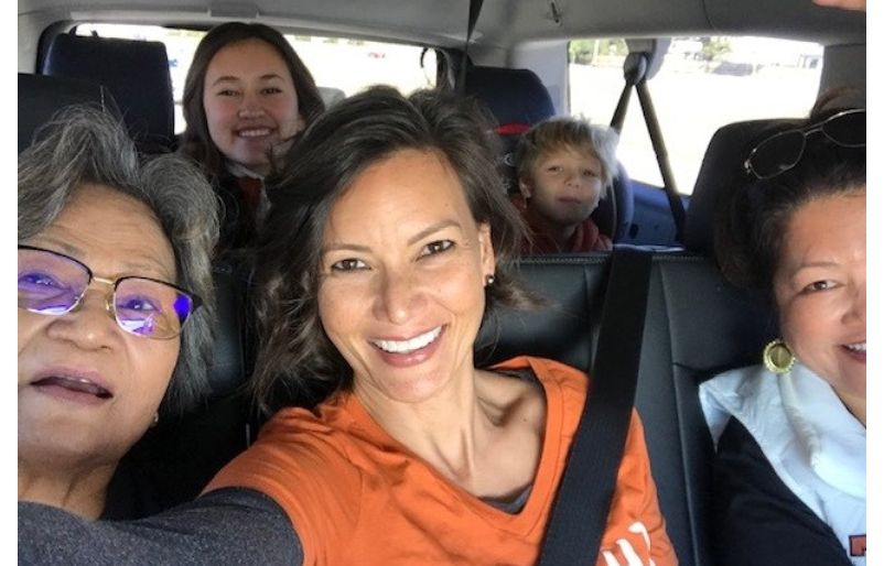 Ashley, pictured front center, taking a selfie with her Texas family while on their way to a football game. Editor's Note: This photo was taken prior to the pandemic. Kim Ashley