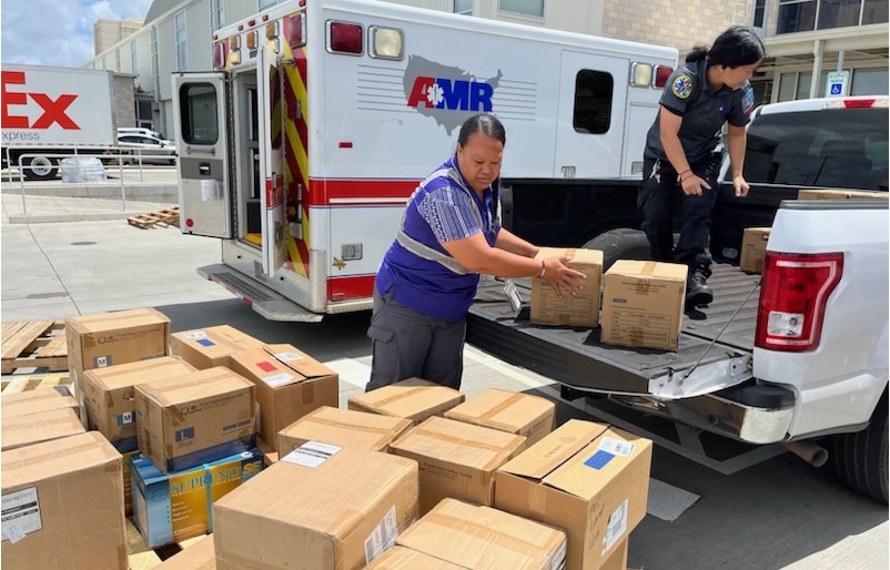 A cargo agent helped first responders load emergency supplies onto a pallet that was to be shipped to Kahului, Maui for the West Maui community. HACargo 2