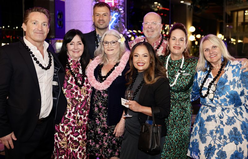 Kathy Mainerd, senior manager of South Pacific airport operations, was among Hawaiian's first employees hired in Sydney, and also commemorated her 20th anniversary with the company. Here, she is pictured with a special lei alongside several of Hawaiian's current Australia-based team members. SYD 20th 7