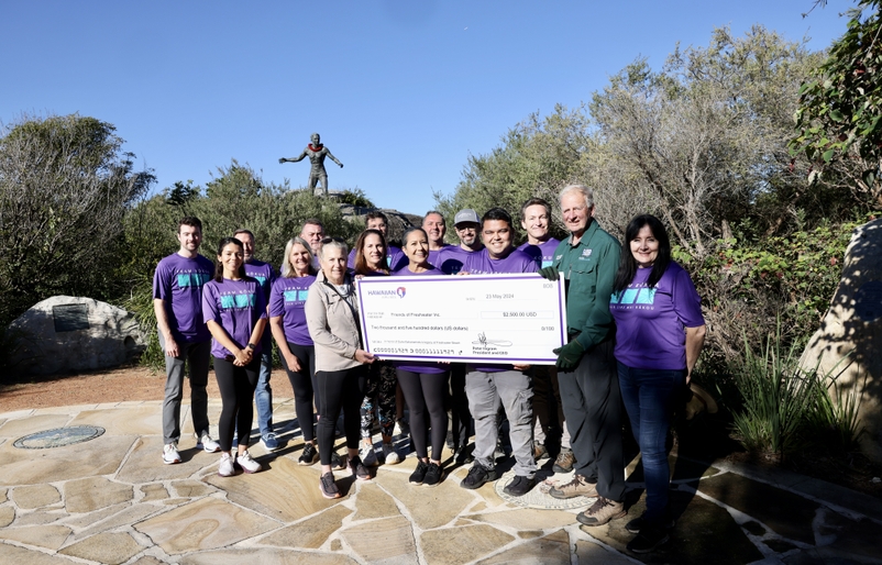 Employees surprised Friends of Freshwater with a donation before digging into the day's work. SYD 20th 12
