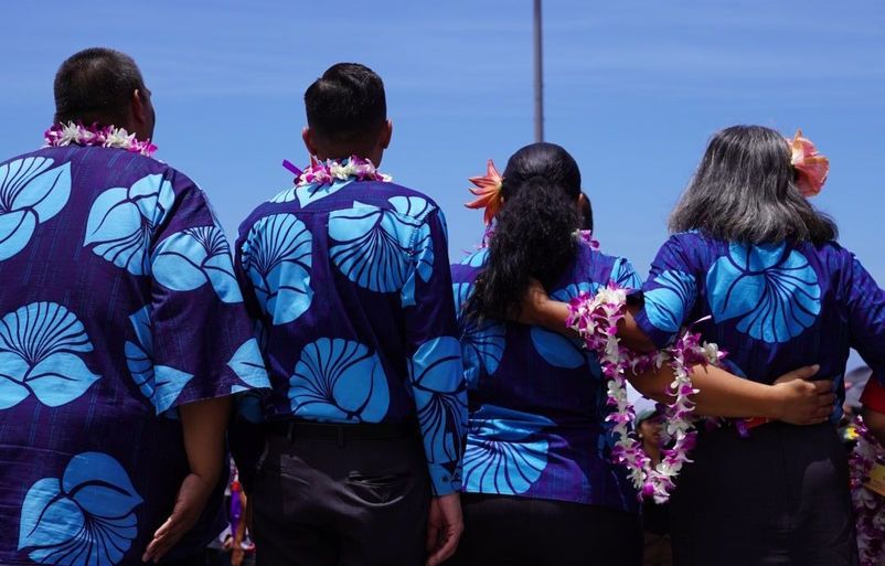 Hawaiian's employees who returned to their high school gathered on the football field to help their community and share a memorable moment with Lahaina youth. HAL02200