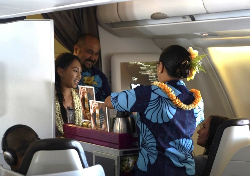 Sadi Yu, owner of Sweetheart Farm, joined Hawaiian Airlines flight attendants to offer her lilikoi butter on a flight from Kona to Los Angeles. HAL03182