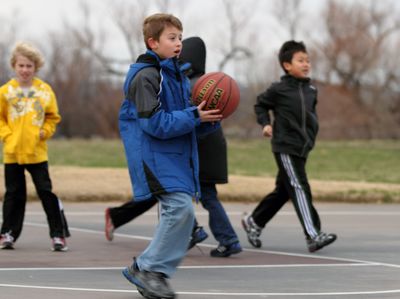 Boys playing basketball outsidecopyright American Heart Association
