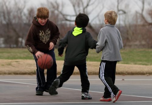 Boys playing basketball outsidecopyright American Heart Association
