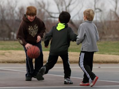 Boys playing basketball outsidecopyright American Heart Association