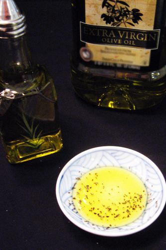 Olive oil in a small bowl with bottlecopyright American Heart Association