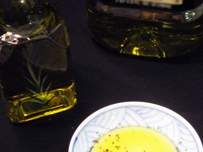 Olive oil in a small bowl with bottlecopyright American Heart Association