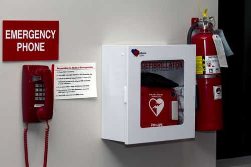 Wall mounted AED with emergency phonecopyright American Heart Association