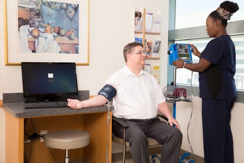 Nurse taking blood pressure of male patient at UTSW Medical Center in Dallas, Texascopyright American Heart Association