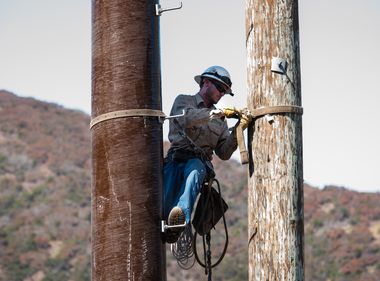 Crews Install Fiberglass Power Poles in High Fire Risk Areas