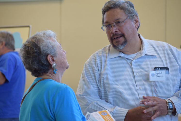 G. Garcia talks to a resident about Wastewater Management Plan