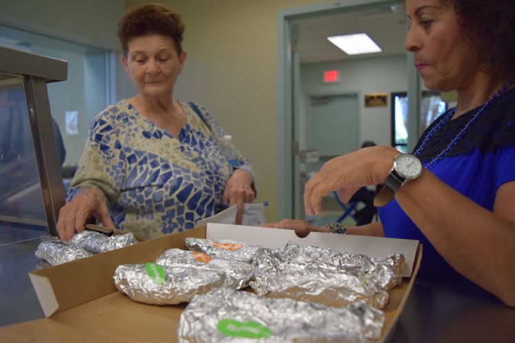 Patrons Celebrating National Taco Day at Broadmoor Senior Center