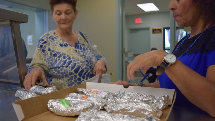 Patrons Celebrating National Taco Day at Broadmoor Senior Center