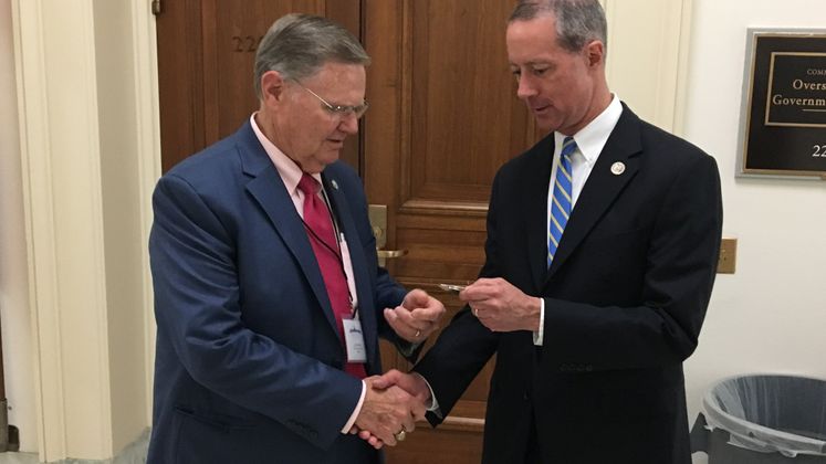 Mayor Joe McComb Presents House Armed Services Committee Chairman Mac Thornberry with a City Challenge Coin During the Chamber's CB to DC Event