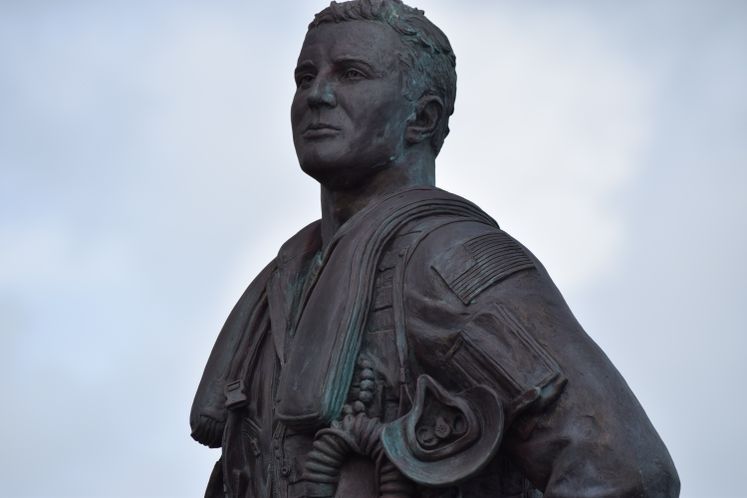 flags, statue, aviator