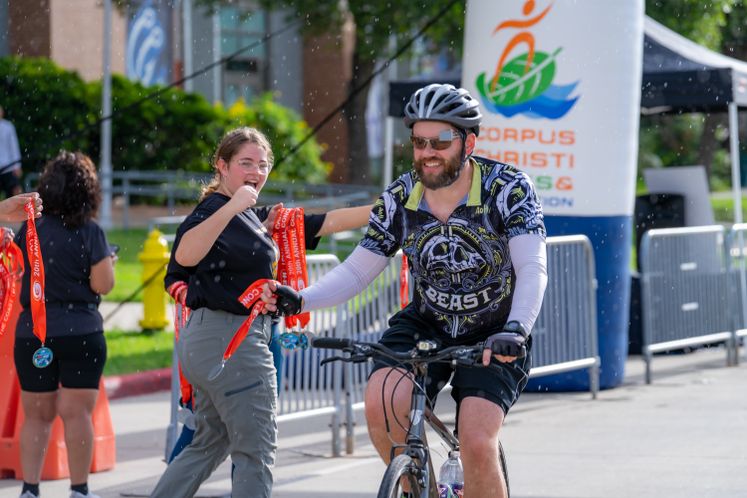 Conquer The Coast Medal Handoff