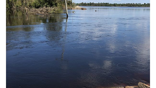 River water continues to flow into Sutton Lake through a breach in the dam. Photo uploaded Sept. 26, 2018.