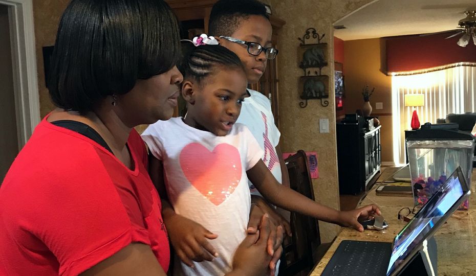 Patricia Mathis and her children, Reece and Royce, FaceTime with Roy Mathis. 2018-0227-Mathis-Family