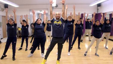 AIE Teaching Artist Cedric Green leads AileyDance Kids at Dual Language Middle School