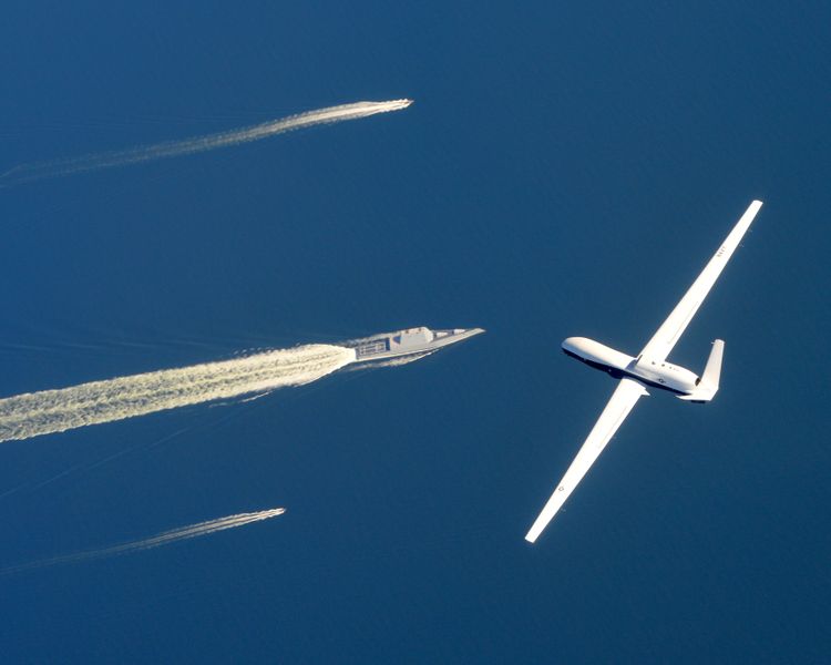 The U.S. Navy Triton takes its 100th flight, soaring over the newly commissioned USS Zumwalt near Naval Air Station Patuxent River, Md. in October, 2016. Triton Soaring Toward Operational Status