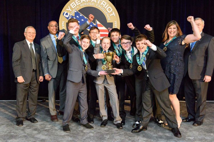 Middle School Champions: Students and their coaches from Team “Error 37" of Summit Lakes Middle School (Lee's Summit, Missouri), earned the title of National Champion for the Middle School Division at the CyberPatriot IX National Finals Competition. The award was presented April 5 by Chris Jones, corporate vide president and president, Northrop Grumman Technology Services. Also pictured are CyberPatriot Commissioner Bernie Skoch (far left) and Dick Bundy, Air Force Association Vice chairman of the Board, Aerospace Education (far right). Photo by David Keith Photography. Northrop Grumman Awards $50,000 in Scholarship Funds to Winning Teams of CyberPatriot IX