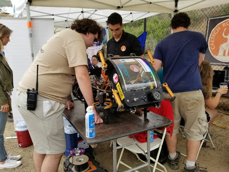 2016 champions CalTech look over their robot at RoboSub. Air, Land and Sea- RoboNation Unites STEM Students Internationally -8