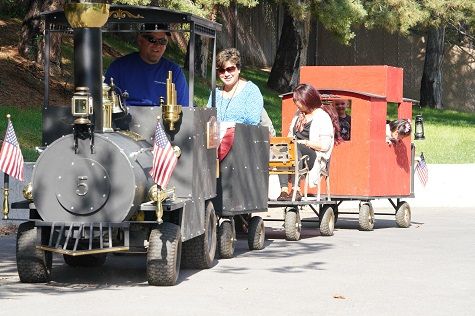 All aboard! Northrop Grumman engineer Craig Rasmussen gives children and staff members a ride. Northrop Grumman Employees Support Annual United Way Campaign_4