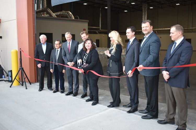 Lisa Brown (center) Northrop Grumman vice president and Mesa site operations lead, cuts the ribbon to officially open the company’s new facility. The 36,000 square foot building combines production and warehousing into one location, nearly doubling the production capability for the division that produces the world renowned Bushmaster line of medium caliber cannons. (pictured left-right: Kevin Sullivan, executive vice president, Arizona Commerce Authority; David Luna, Mesa vice mayor; John Giles, Mesa mayor; Dan Olson, Northrop Grumman armament systems vice president; Lisa Brown, Northrop Grumman vice president and Mesa site lead; Sally Harrison, CEO, Mesa Chamber of Commerce; Rudy Cota, Arizona Congressman Andy Biggs staff, constituent service representative; Bill Jabjiniak, Mesa director of economic development; Chris Keeler, Northrop Grumman deputy director Mesa operations.) Northrop Grumman Expands Arizona Operations