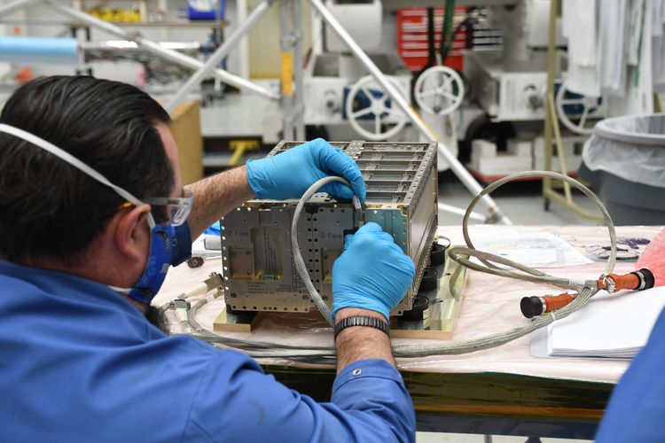 A Northrop Grumman technician readys a ThinSat Stack for launch on the Antares rocket. (Image credit: Virginia Space)